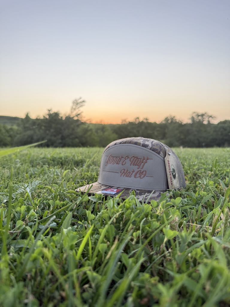 Deep Woods 7 Panel meshback cap with embroidered script, designed for outdoor adventures.