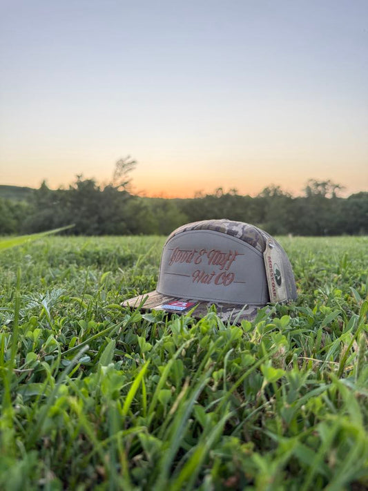 Deep Woods 7 Panel meshback cap with embroidered script, designed for outdoor adventures.