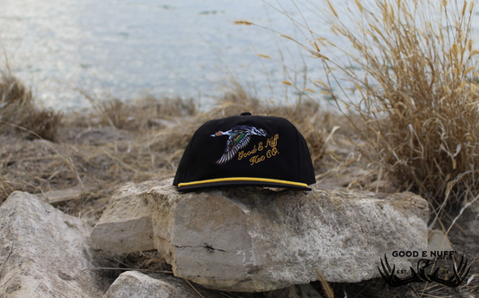 Old School Pintail black hat with pintail embroidery and golden script logo.