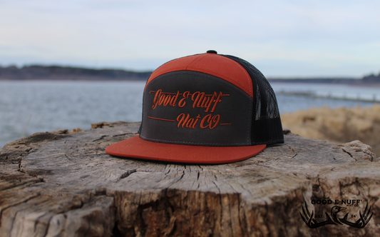 Copper hat with "Good E Nuff' Hat Co." logo, flat bill, snapback, breathable mesh back.