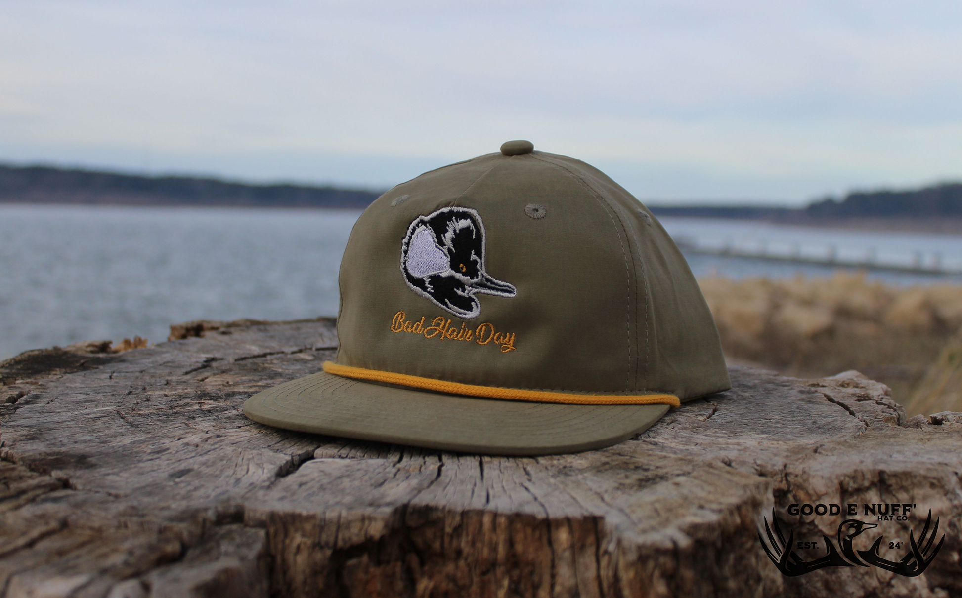 Olive green "Bad Hair Day" hat with duck embroidery and mustard rope accent.