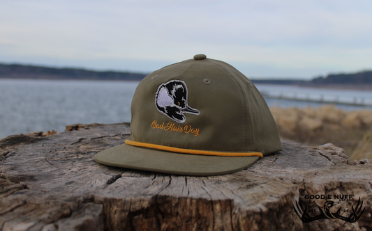 Olive green "Bad Hair Day" hat with duck embroidery and mustard rope accent.