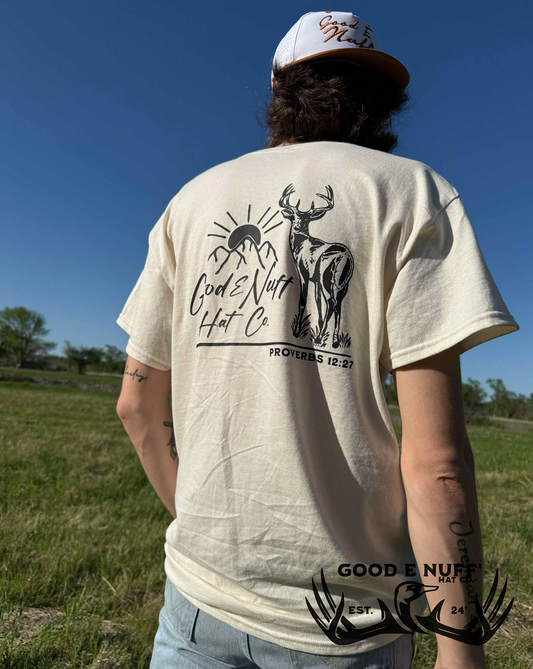 The Diligent shirt featuring Proverbs 12:27 with sunrise, buck, and mountain design for hunters.