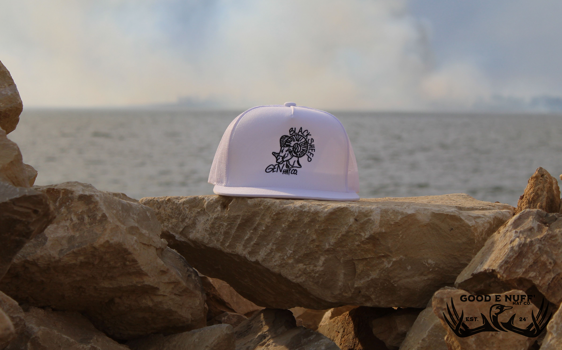White cap with "Black Sheep" graphic, symbolizing individuality.